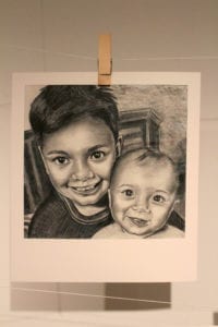 Black and white drawing of a Polaroid picture of two young brothers