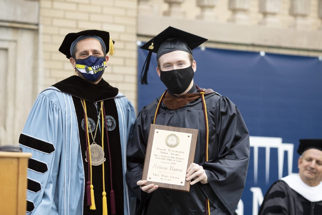 Ashton Barrie poses with his award and Dr. Giordano